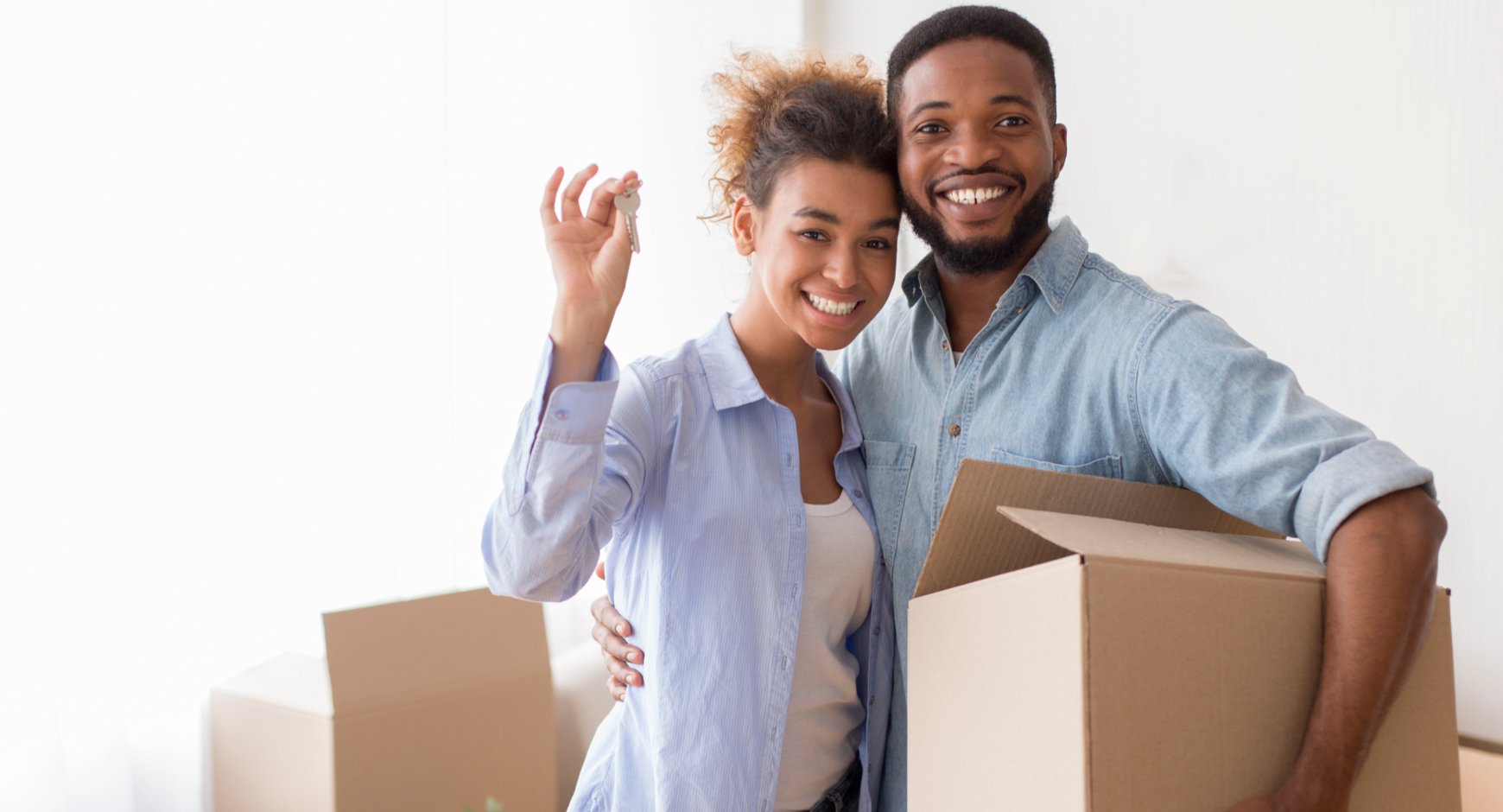 Black couple with moving boxes