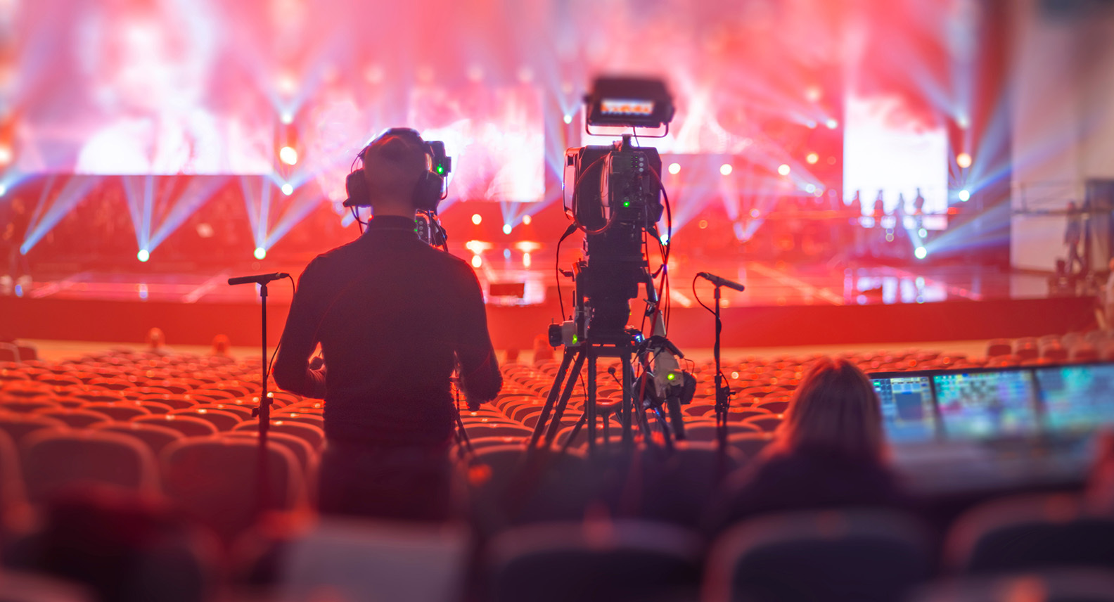 Two people recording a live performance